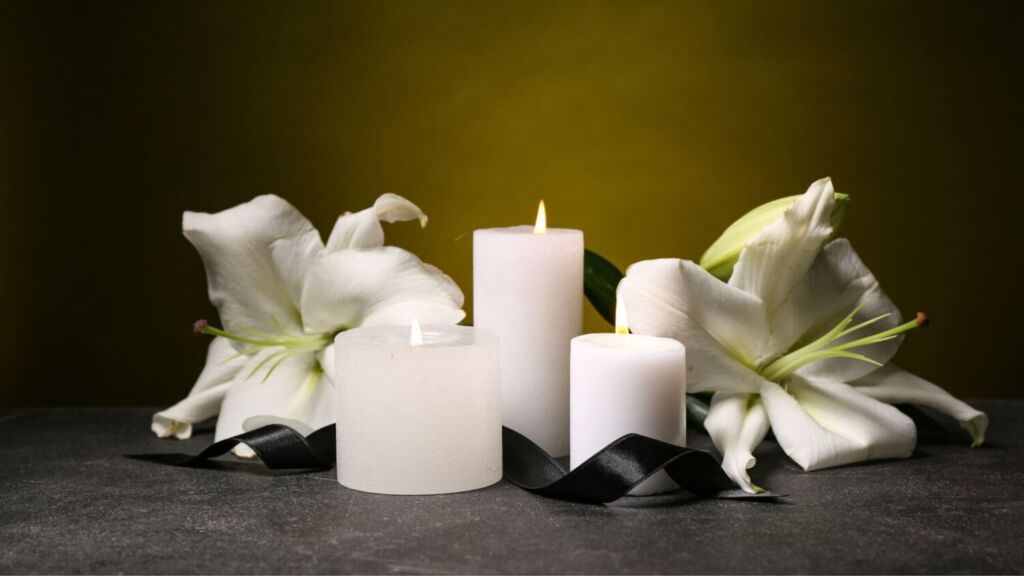 funeral flowers and candles